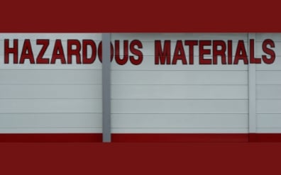 A large hazardous materials warning label.